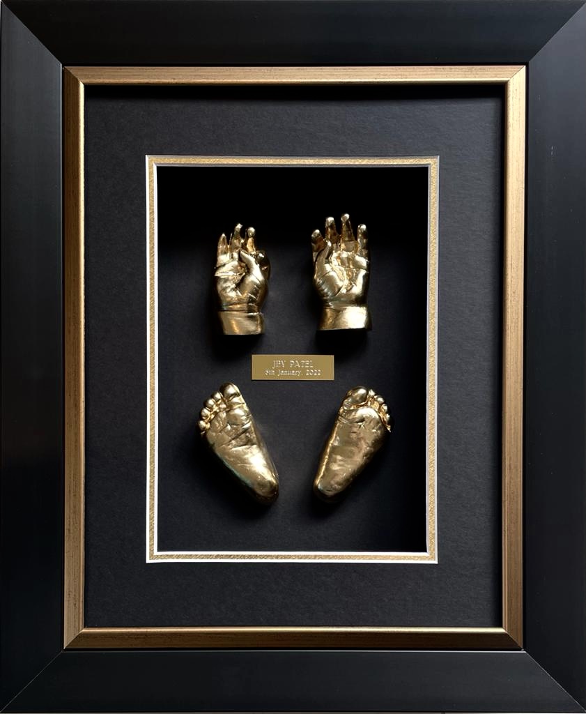 Baby footprints preserved in decorative frame