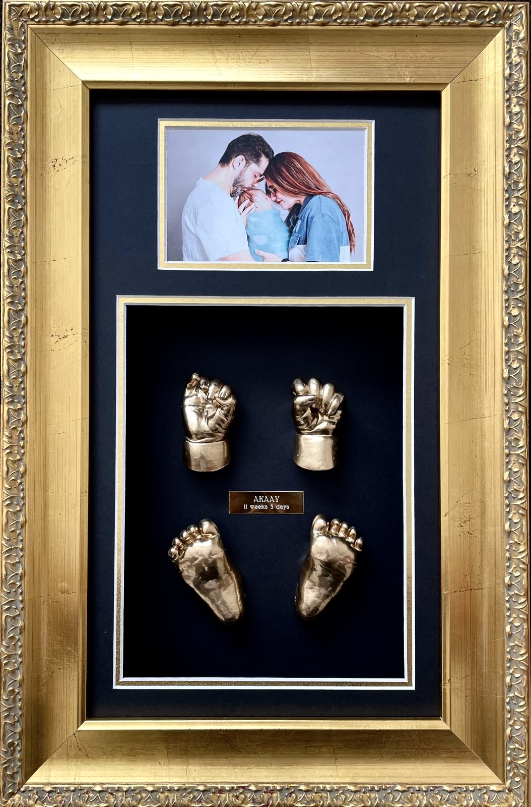 Detailed newborn baby casting showing tiny wrinkles