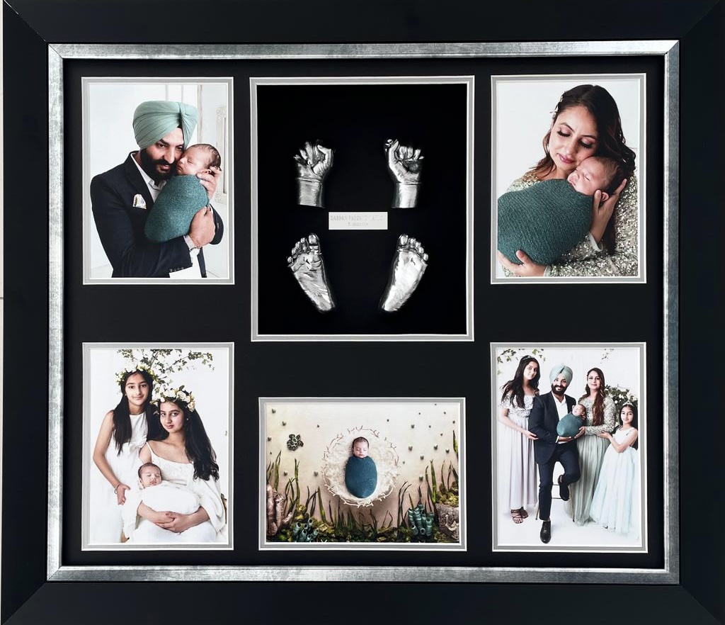 Pair of baby feet castings in classic black frame