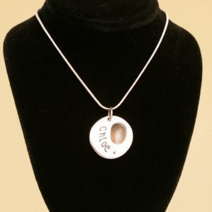 20250910_1043_Fingerprint Necklace Displayed_remix_01k4s0kg9efbnss42c4qptyx59